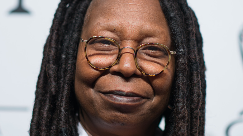 Whoopi Goldberg poses on the red carpet