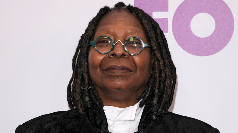 Whoopi Goldberg posing on the red carpet