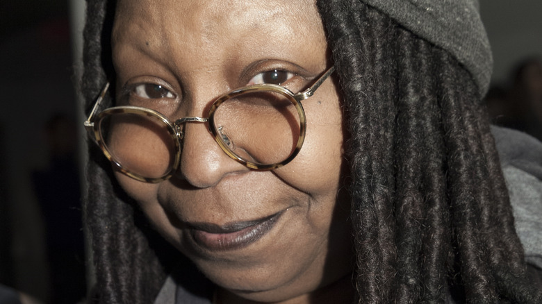 Whoopi Goldberg smirking