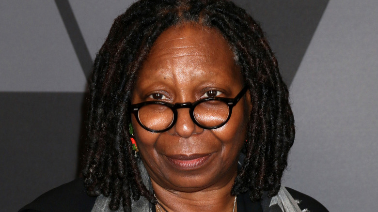 Whoopi Goldberg posing in glasses