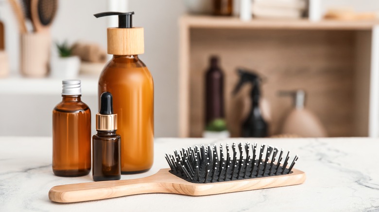 Hair brush and cosmetic bottles