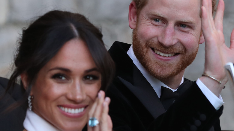 Meghan and Harry wave on their wedding day