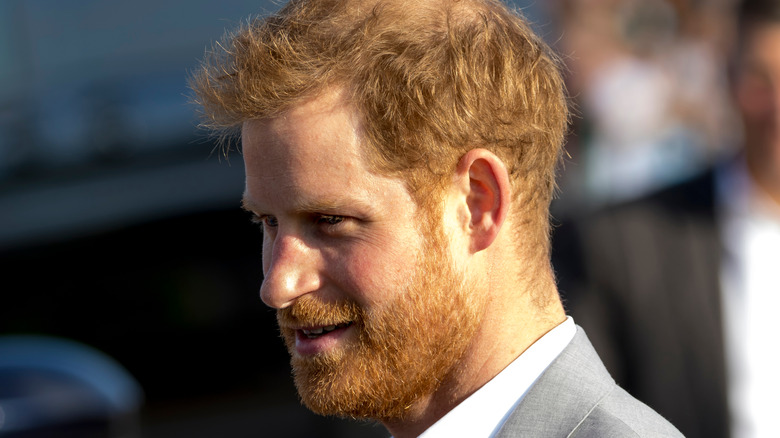 Prince Harry wears a gray suit