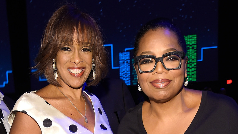 Gayle King and Oprah Winfrey smiling