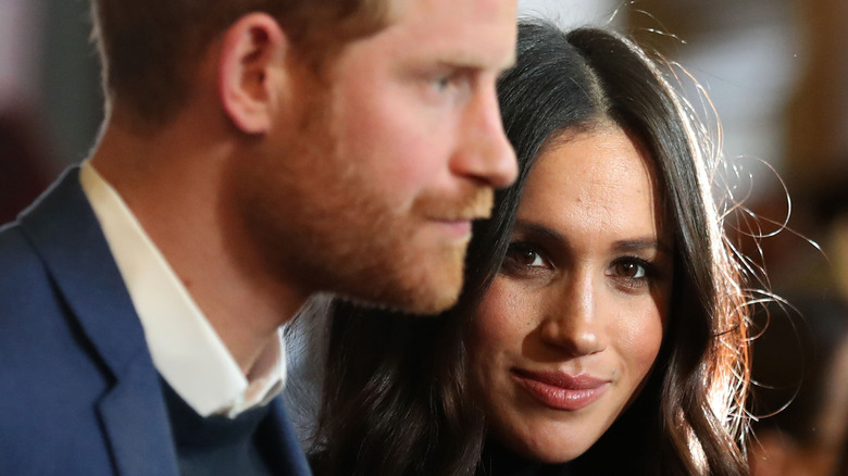 Meghan Markle and Prince Harry attend an event