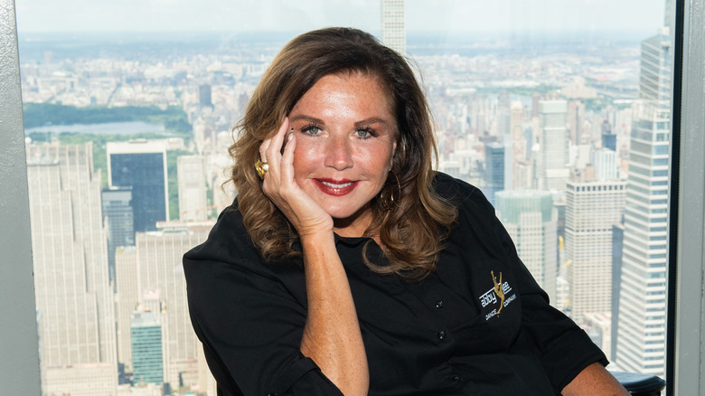Abby Lee Miller in front of city skyline