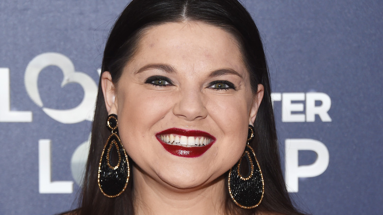 Amy duggar smiling at event