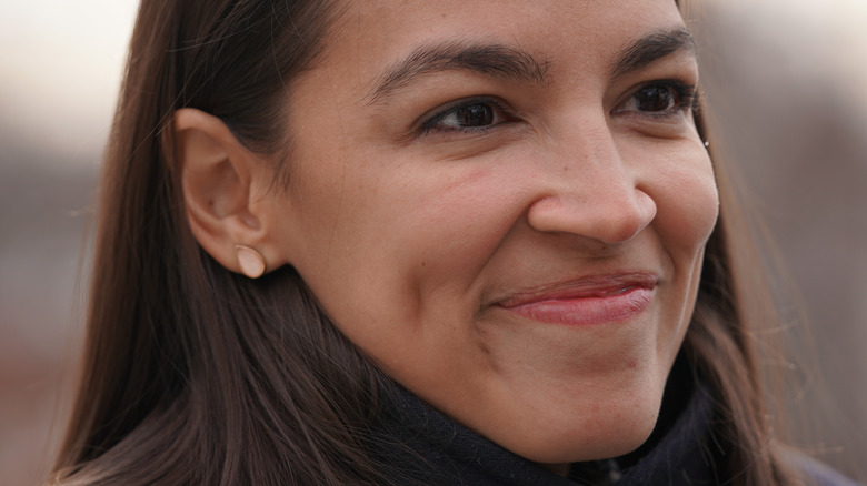 close up of AOC smiling