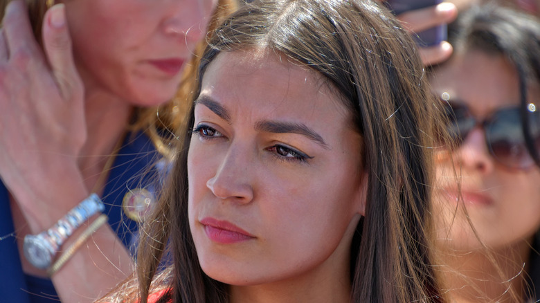 Alexandria Ocasio Cortez looking serious