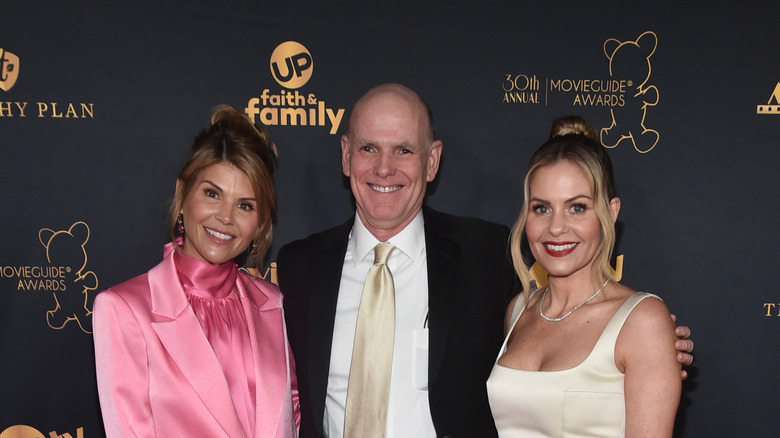 Lori Loughlin, Bill Abbott, and Candace Cameron Bure smiling 
