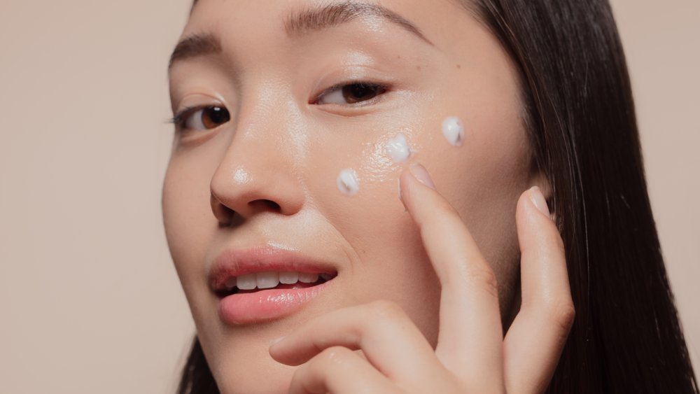 Woman applying cream