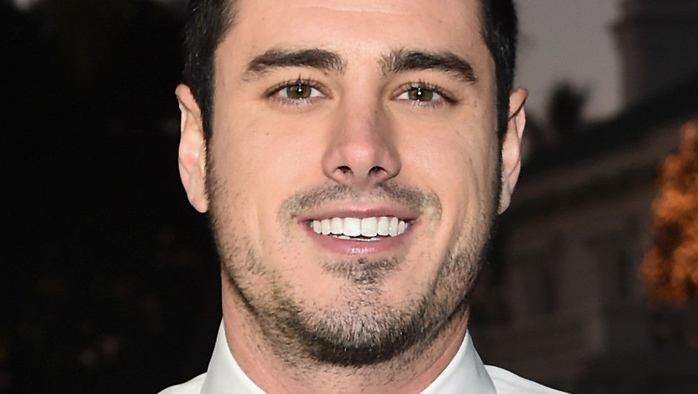 Ben Higgins smiles at event