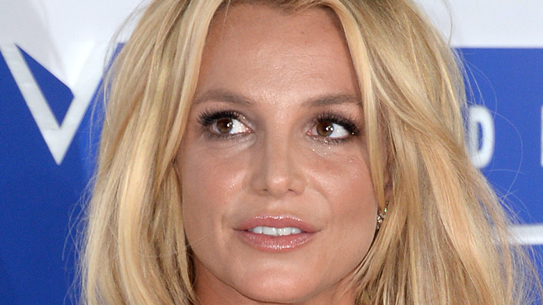 Britney Spears rocks a black dress at an event.