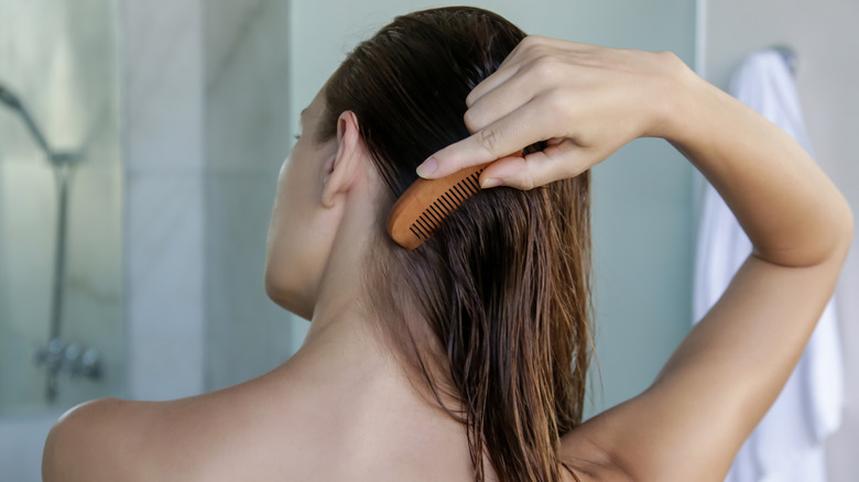 A woman combing her hair