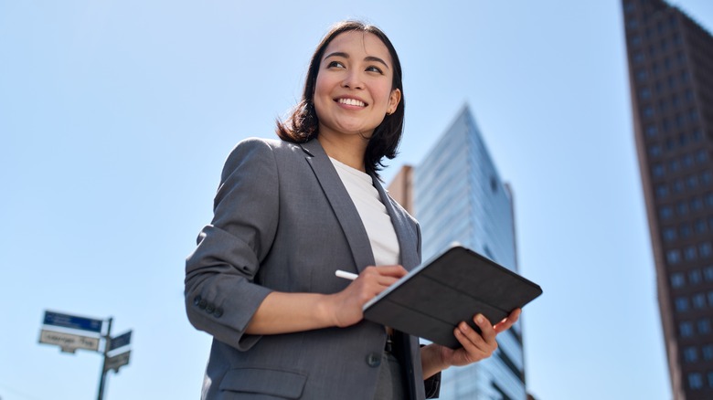 Career woman with a skyline behind her