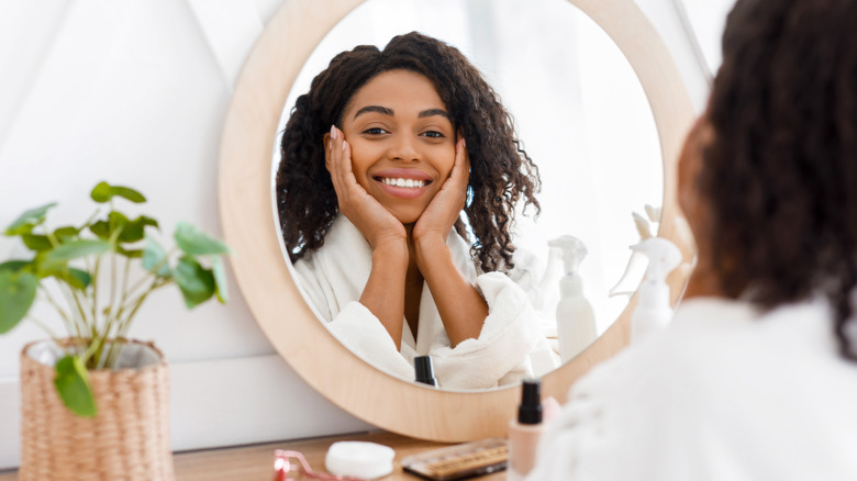 Woman smiling in mirror