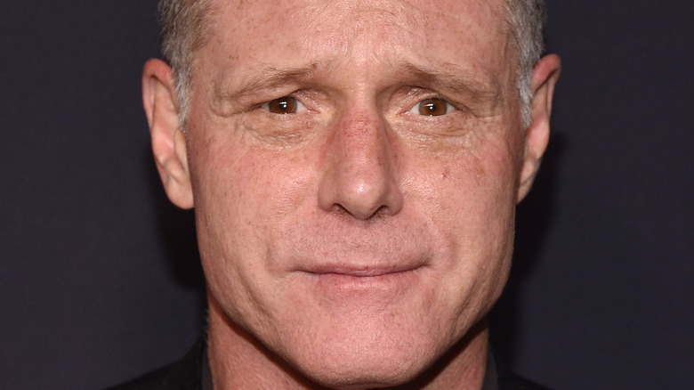Jason Beghe poses on the red carpet