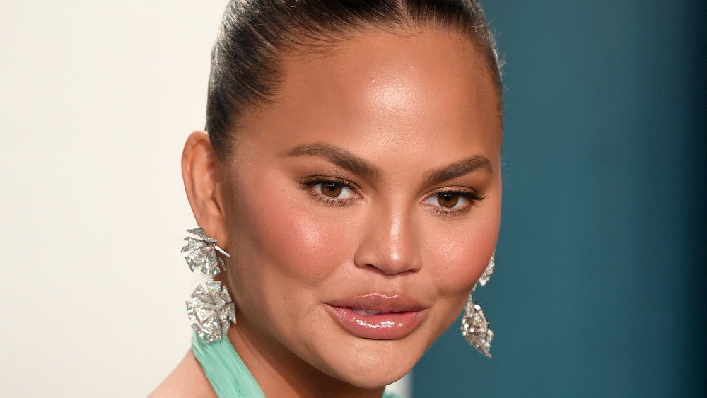 Chrissy Teigen with hair pulled back