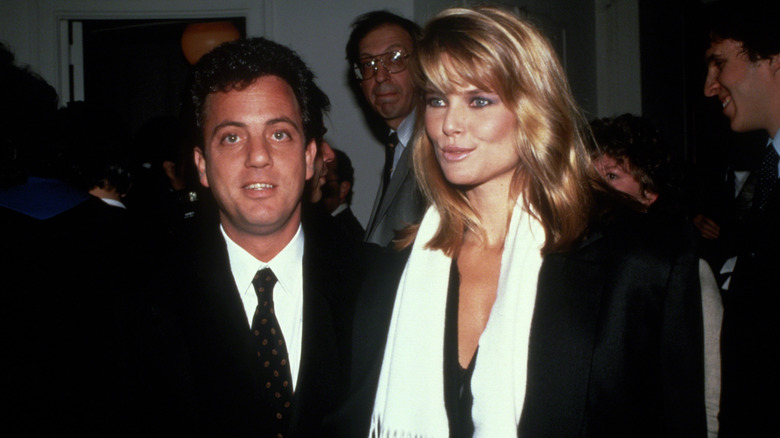 Billy Joel and Christie Brinkley posing for photos