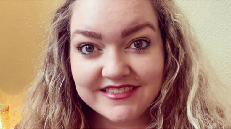 Colleen Hoover smiling for Instagram photo.