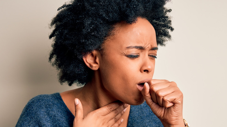 Woman coughing
