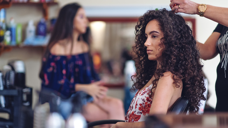 curly-haired woman at salon