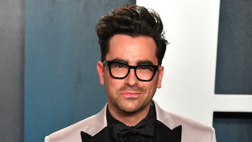 Dan Levy posing