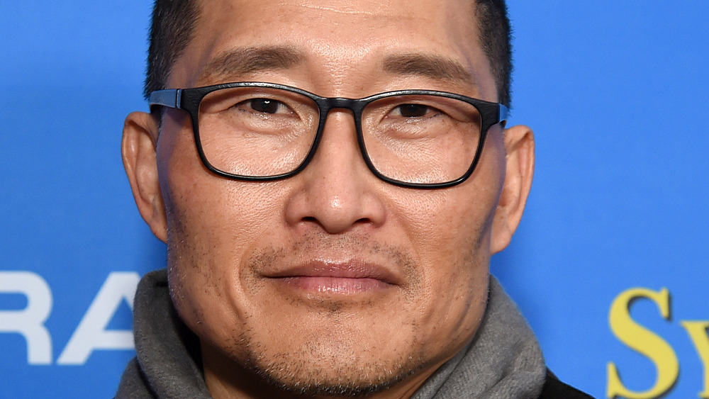 Actor Daniel Dae Kim grinning with glasses