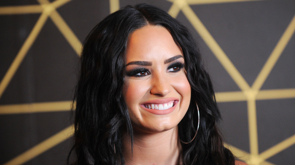 Demi Lovato smiling on red carpet
