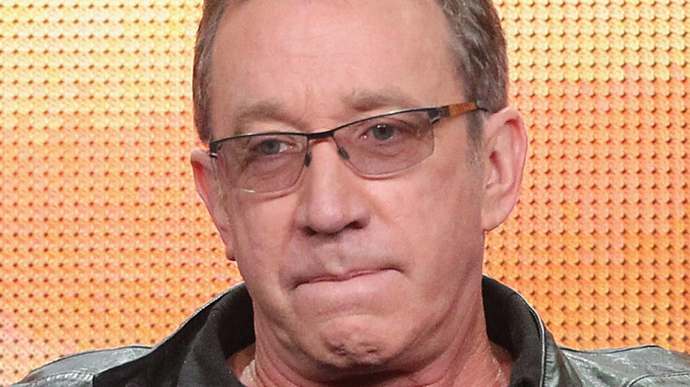 Tim Allen looking serious in glasses