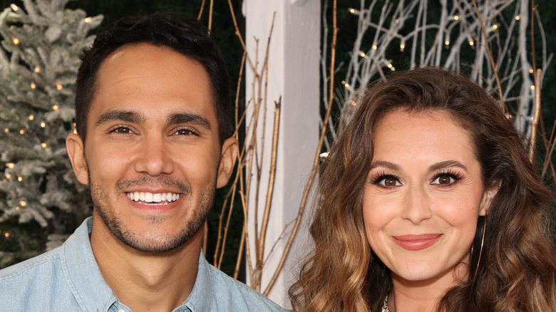 Carlos and Alexa PenaVega posing at event