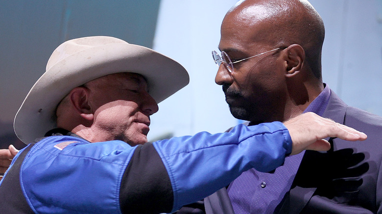 Jeff Bezos and Van Jones embracing 