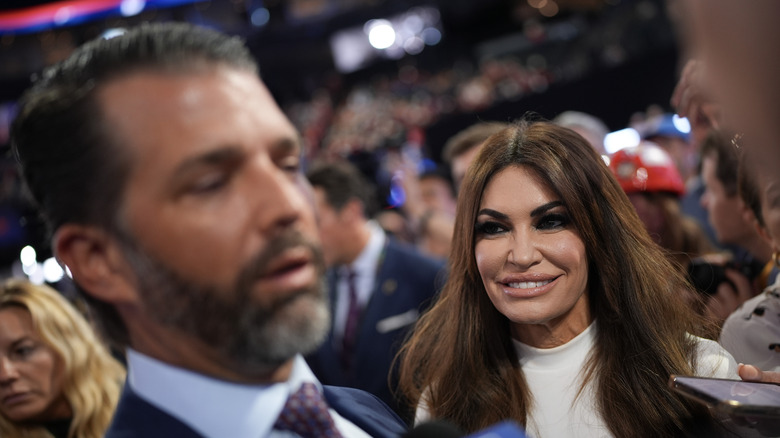 Kimberly Guilfoyle smiling at Donald Trump Jr.