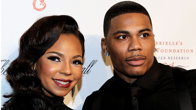 Nelly and Ashanti posing for pics