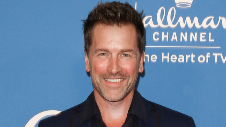 Paul Greene smiling while posing at a Hallmark event