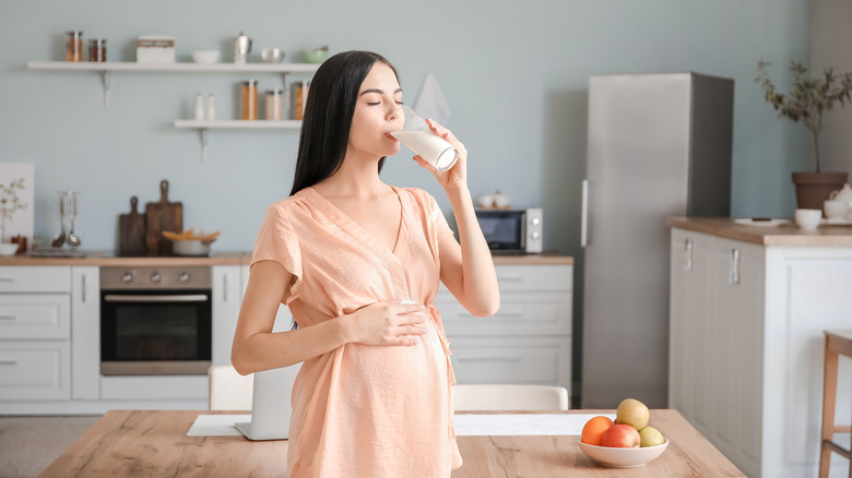 Pregnant woman drinking milk