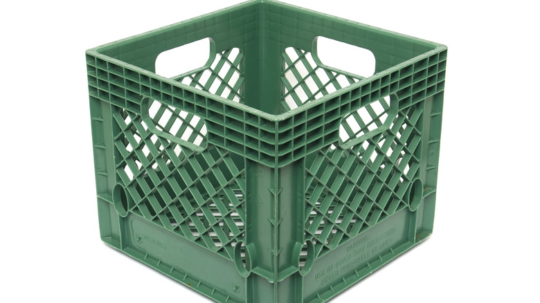 Green plastic milk crate