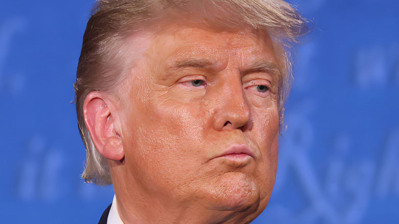 Former President Donald Trump piercing his lips