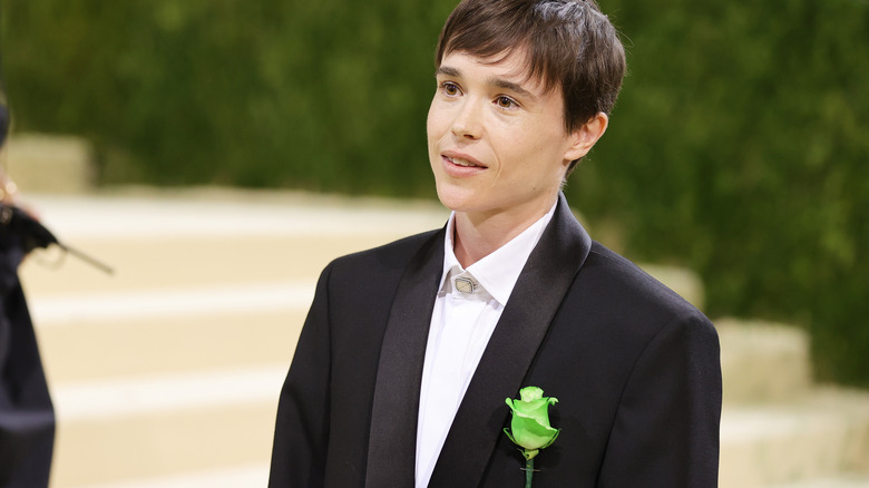 Elliot Page posing at the met gala 2021