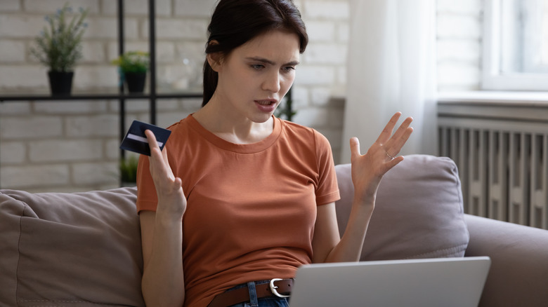 Woman frustrated using laptop