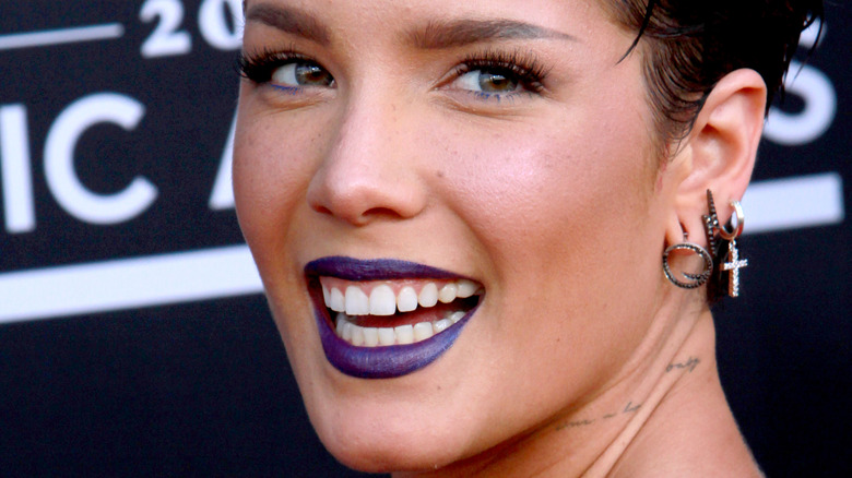 close up of Halsey with short hair and dark lipstick