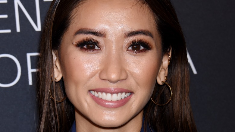Brenda Song smiling at an event