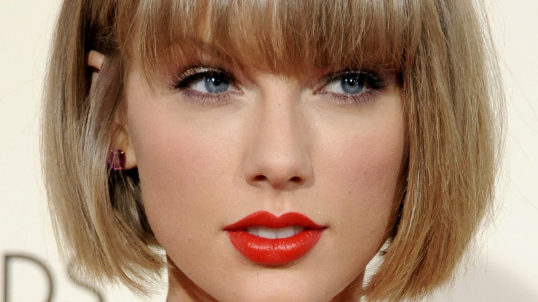 Taylor Swift with short bob and bangs and red lips 
