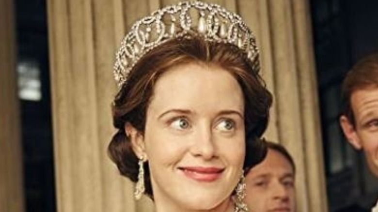 Claire Foy smiling in The Crown