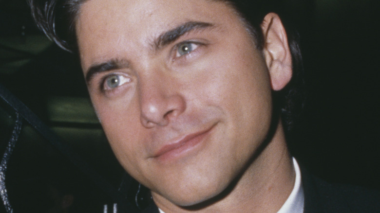 Young John Stamos posing 