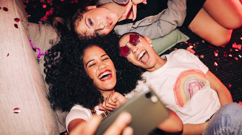 Women at a party taking a selfie