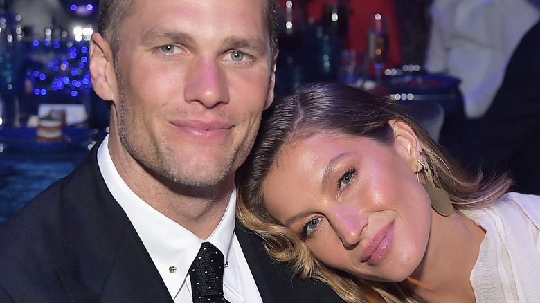 Tom Brady and Gisele Bündchen cuddle at event