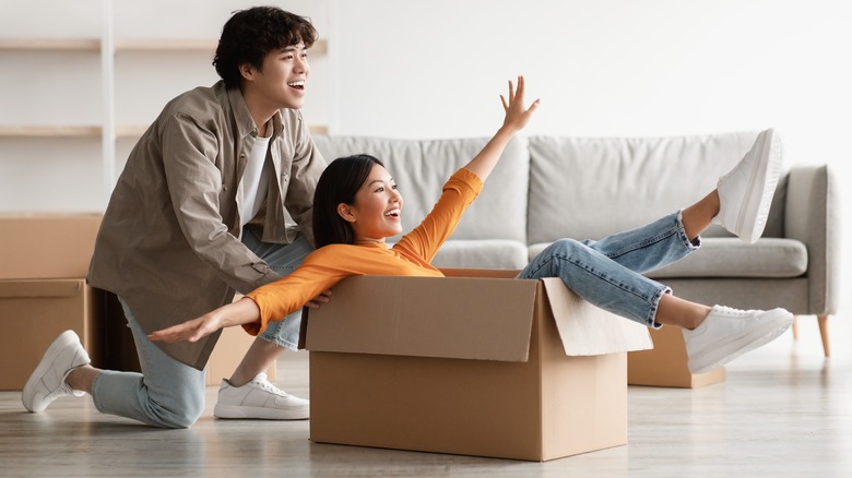 pushing woman in box