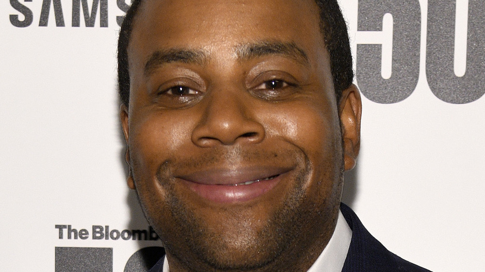 Kenan Thompson smiling on red carpet