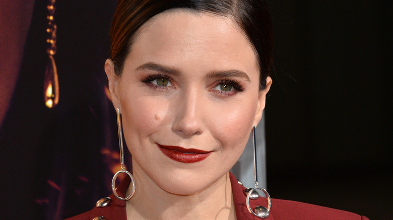 Sophia Bush wearing long earrings